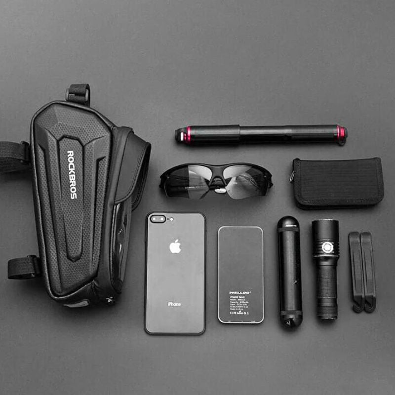 Bike phone bag with daily essentials including phone, glasses and flashlight