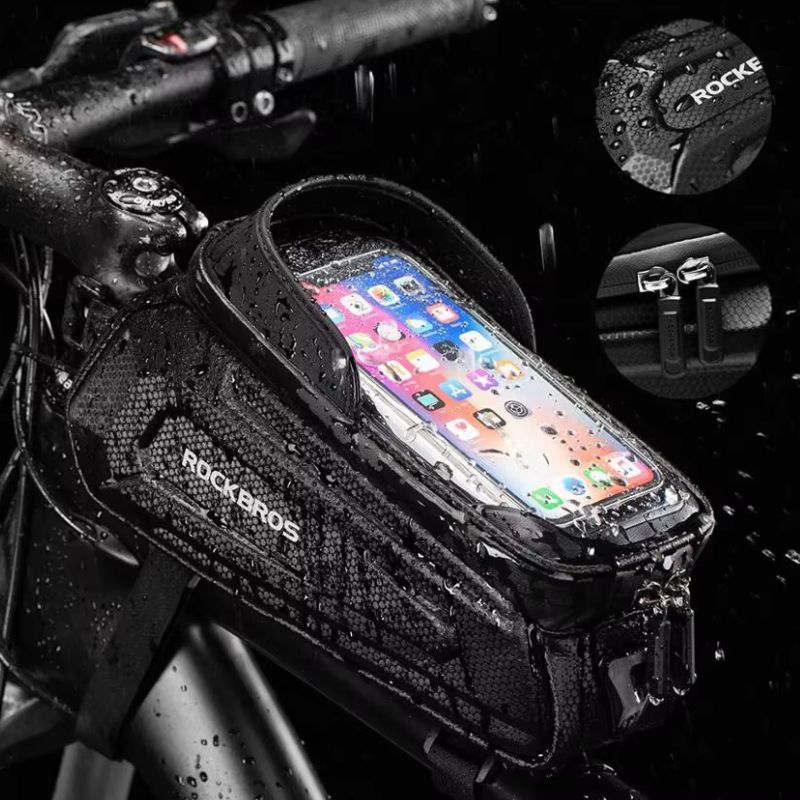 Waterproof RockBros bike phone bag protecting phone in rainy conditions
