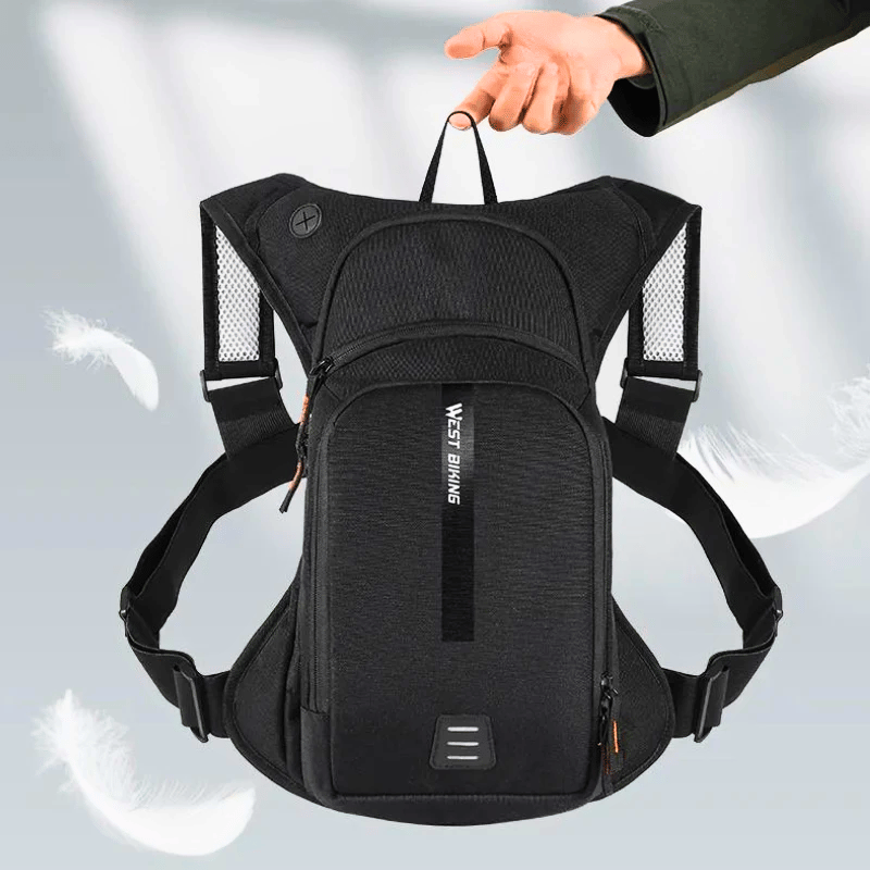 Cyclist wearing lightweight backpack on mountain trail.
