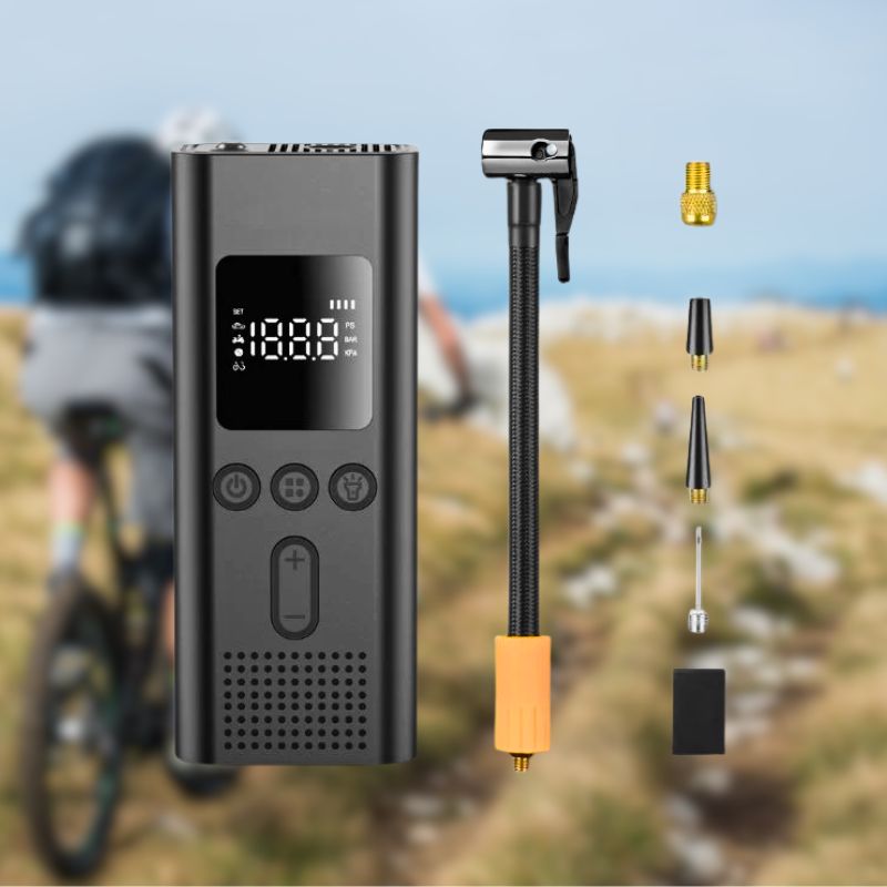 Hand holding cordless air pump inflating a bicycle tyre