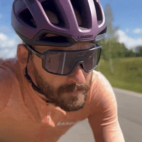 Cyclist wearing photochromic glasses in direct sunlight