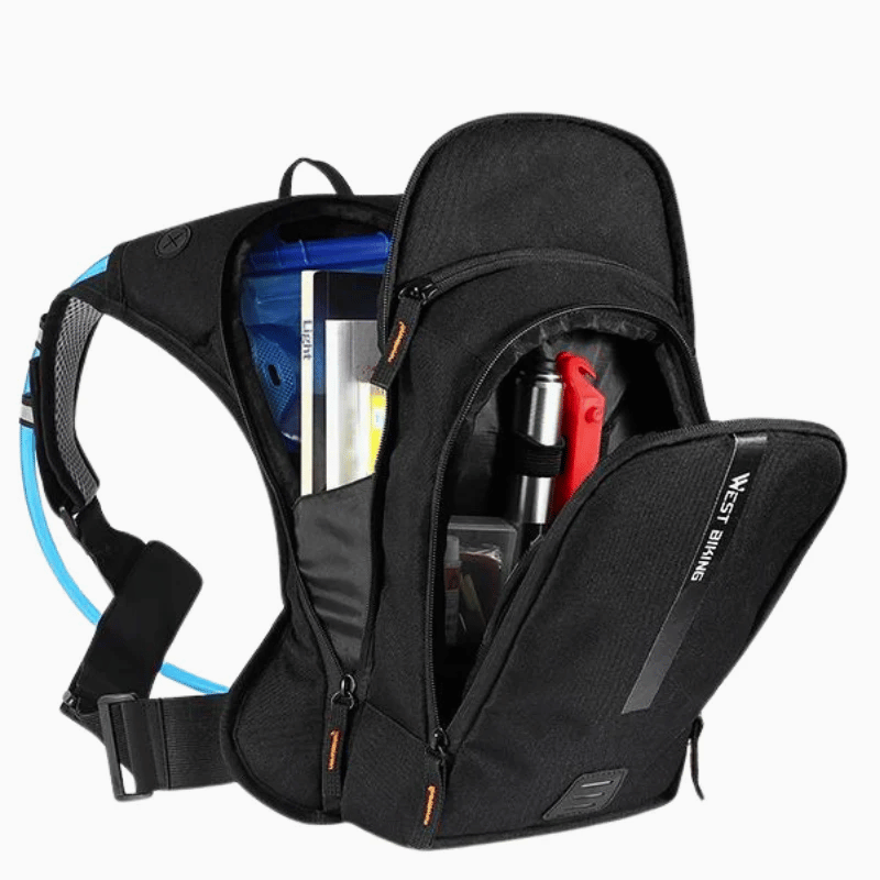 Cyclist wearing lightweight backpack on mountain trail.