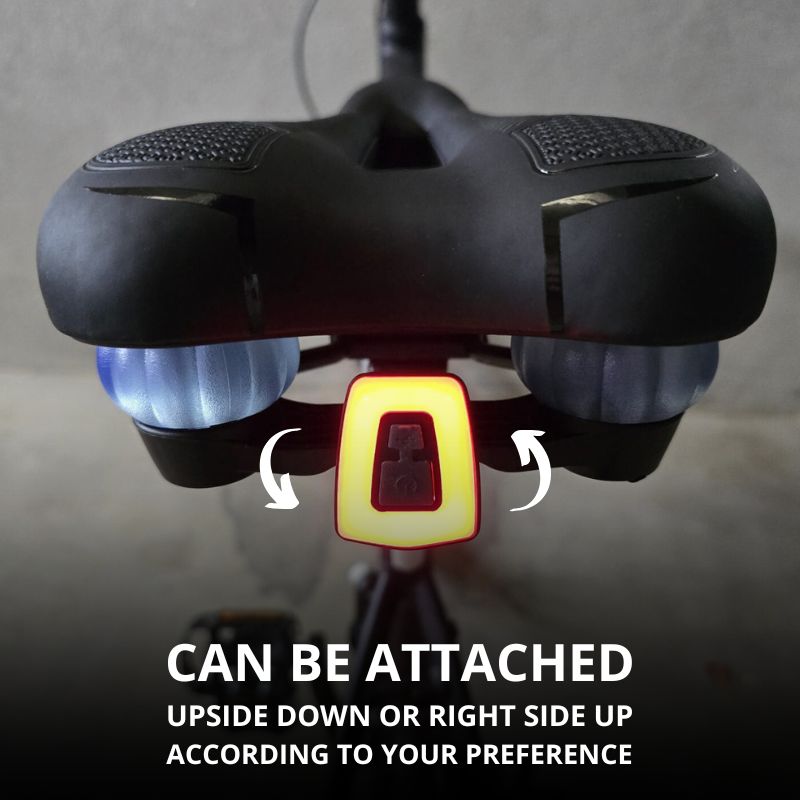 Light clipped upside-down on saddle for customized setup.