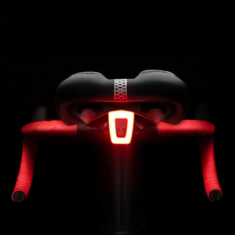 Rear bike light activated at night under the saddle.