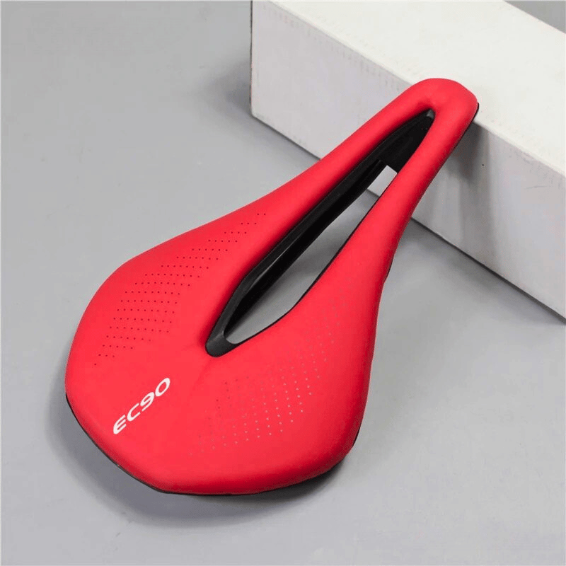 red ultralight bike seat with central cutout for road and MTB bikes – breathable and ergonomic design