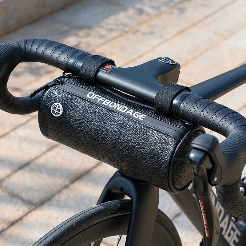 Waterproof handlebar bag securely mounted on a bike, perfect for urban and trail rides.