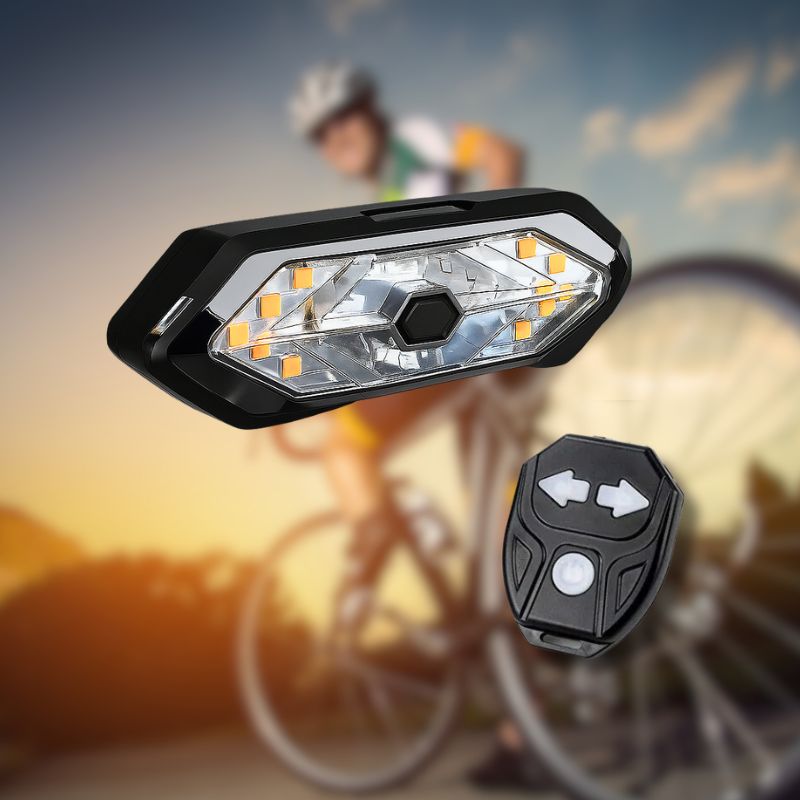 Wireless bike turn signal with remote control in front of a cyclist.