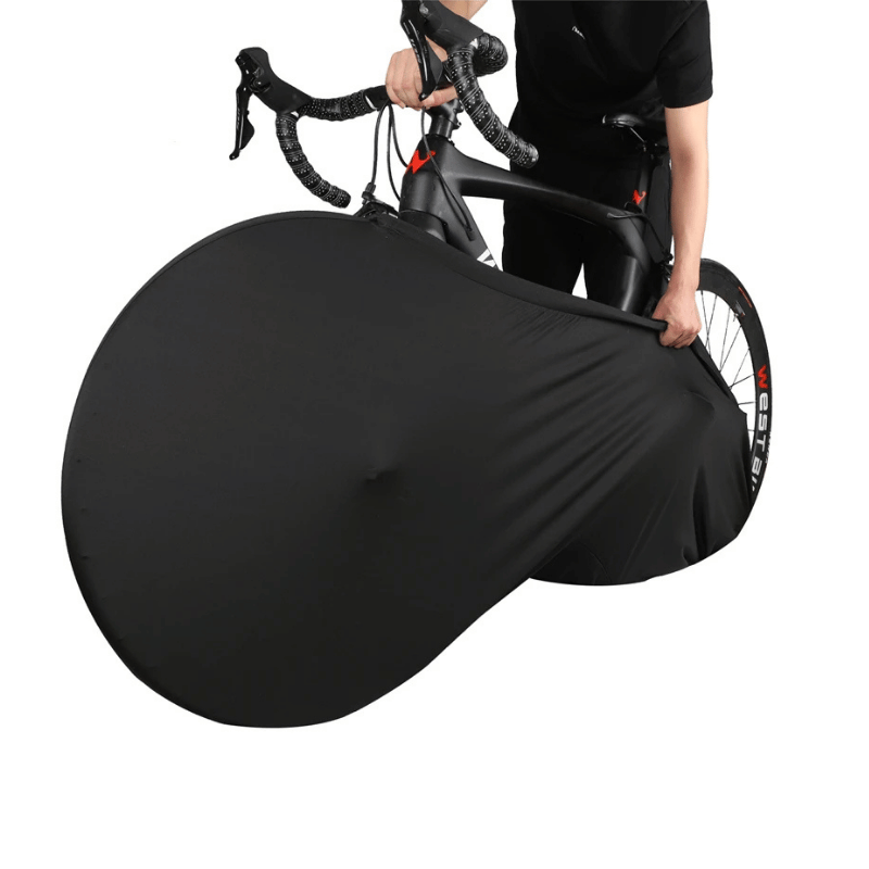 Person fitting a black stretch bike cover on a bicycle with minimal effort