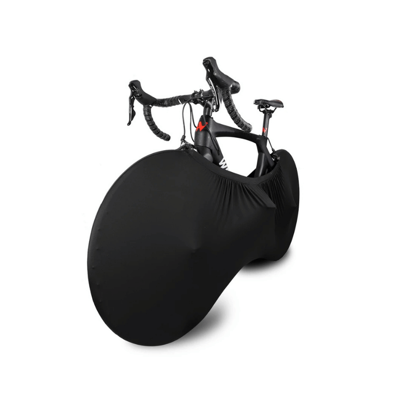 Bike protected by stretch cover leaning on a stone wall with fire and ice design
