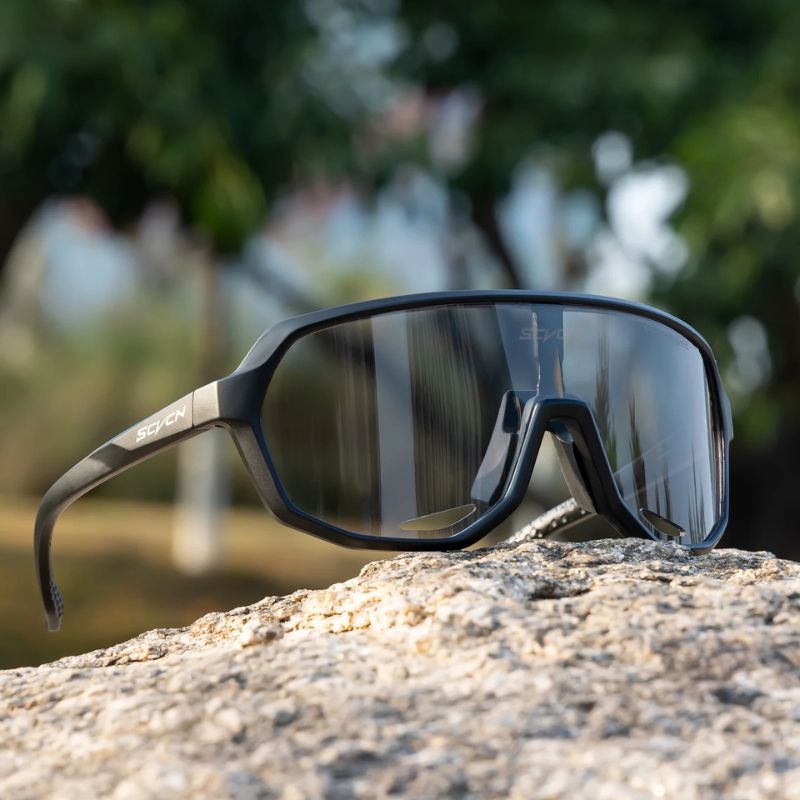 UV400 cycling glasses placed on rock – outdoor exposure test