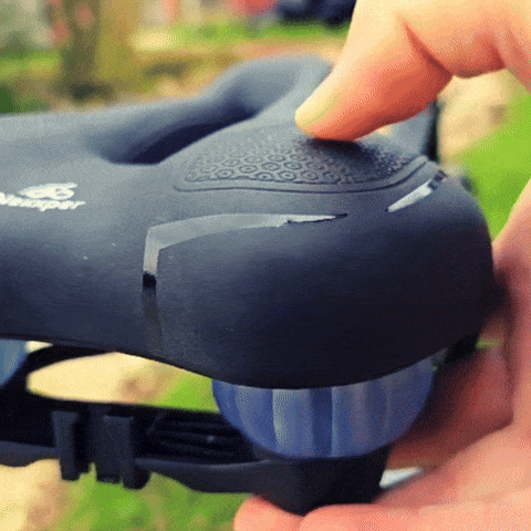 Gel padded bike seat with shock absorbers close-up