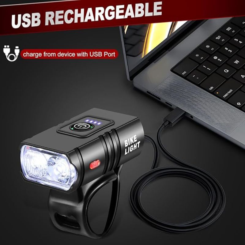 USB bike light plugged into a laptop for recharging